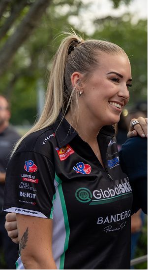 The GlobalSKU logo on a team polo shirt at a race event